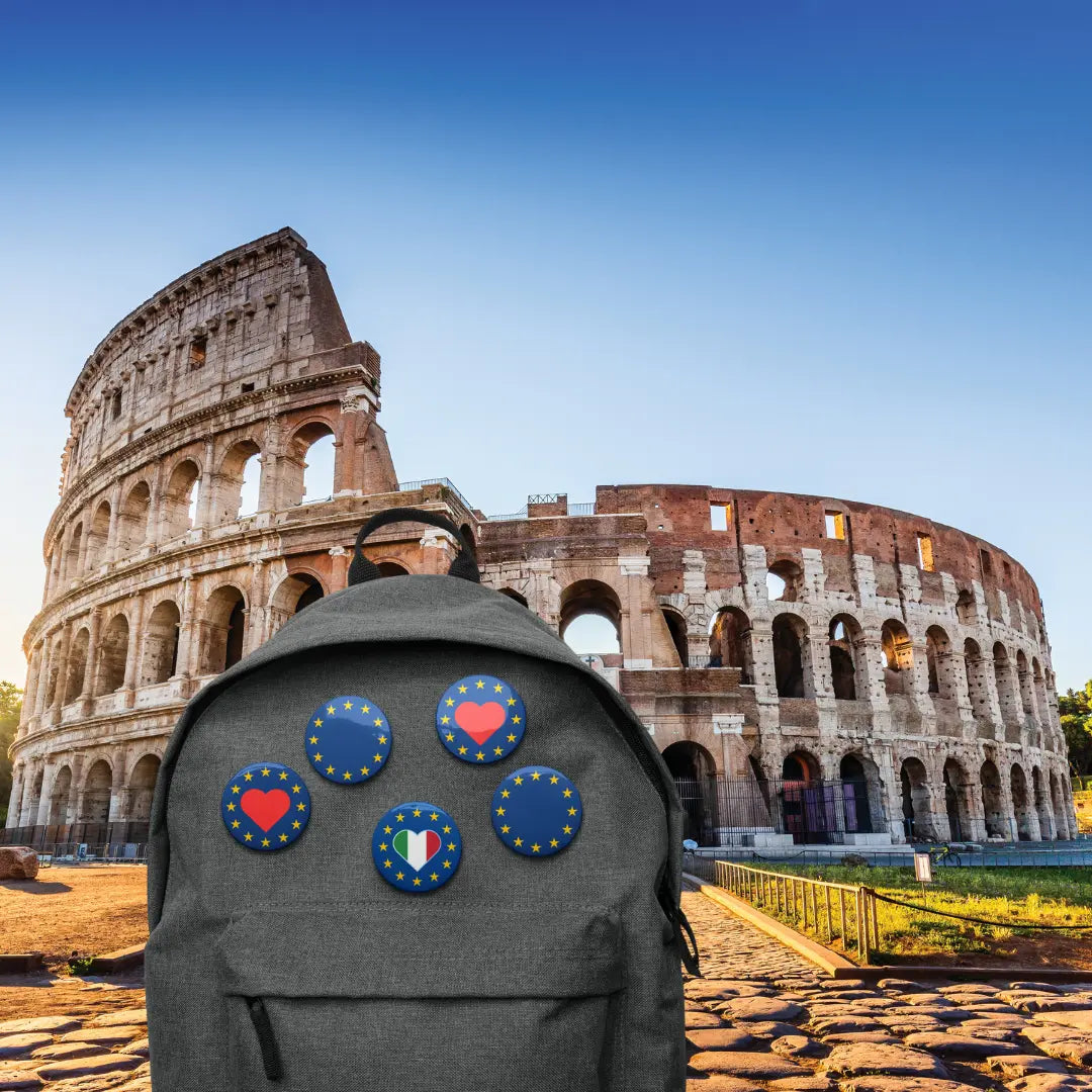 Bakpack with "Show the Love for EU" pins in front of Colosseum, Rome