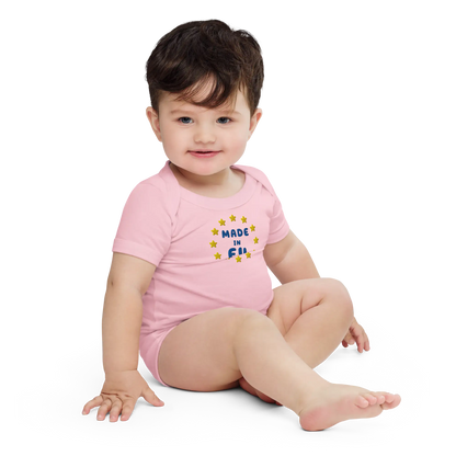 Pink "Made in EU" Embroidered Baby Bodysuit on a Toddler Front View