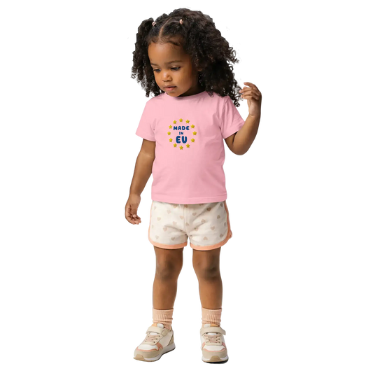 Pink "Made in EU" Embroidered Baby T-shirt on a Girl Front View